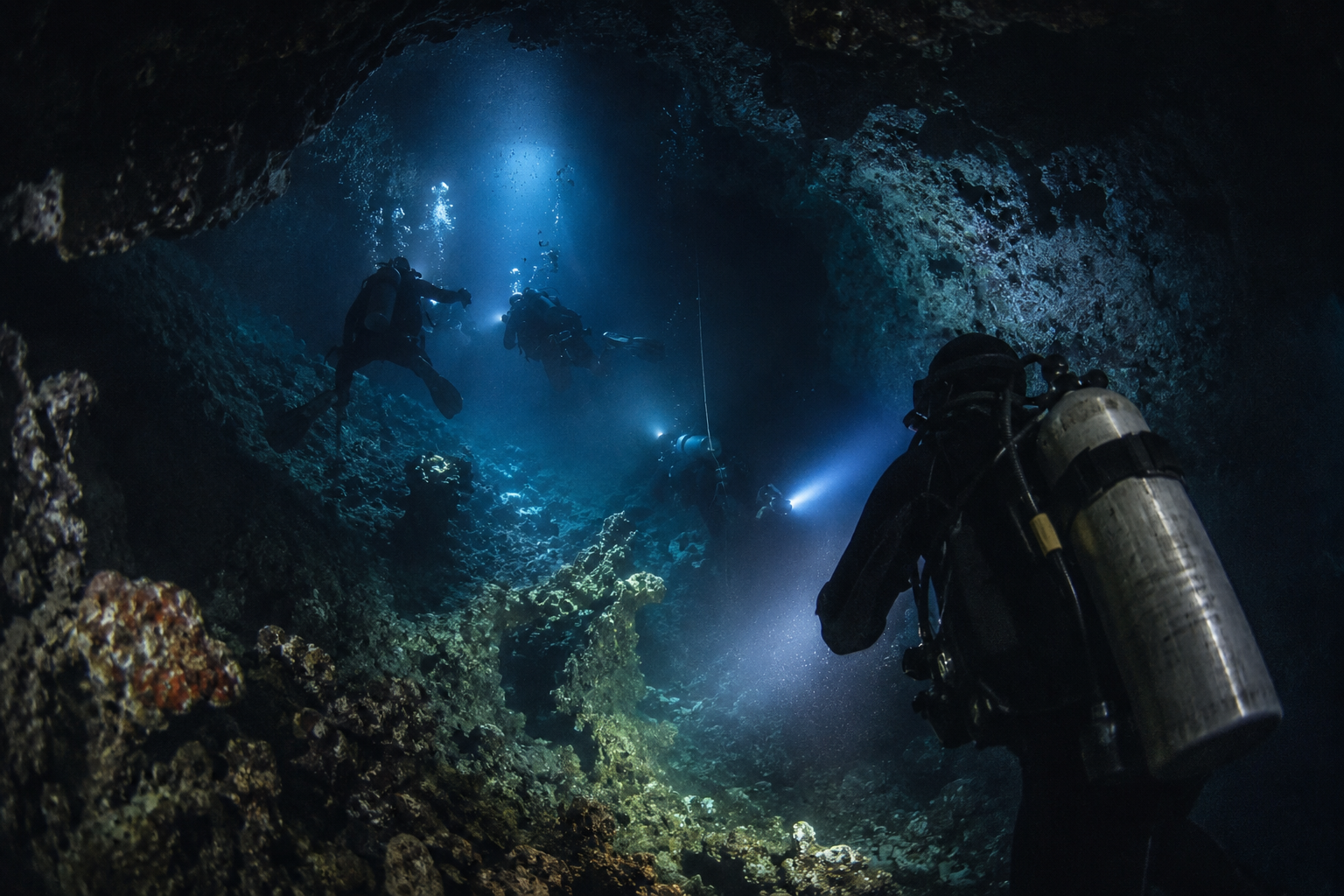 Rescue divers searching inside a deep underwater cave in the Maldives after Italian scuba divers went missing during a tragic diving expedition in Vaavu Atoll.